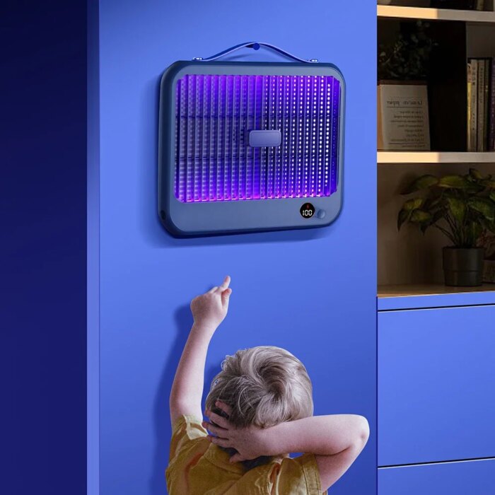 Bug killer for yard hanging from a tree during a summer barbecue