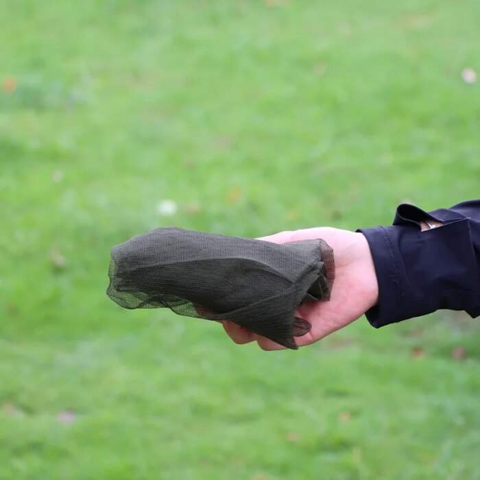 18933-usfcur.jpg Lightweight mosquito net hats packed in a backpack for a hiking adventure