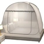 Single-door mosquito net in bed installed on a student’s twin bed