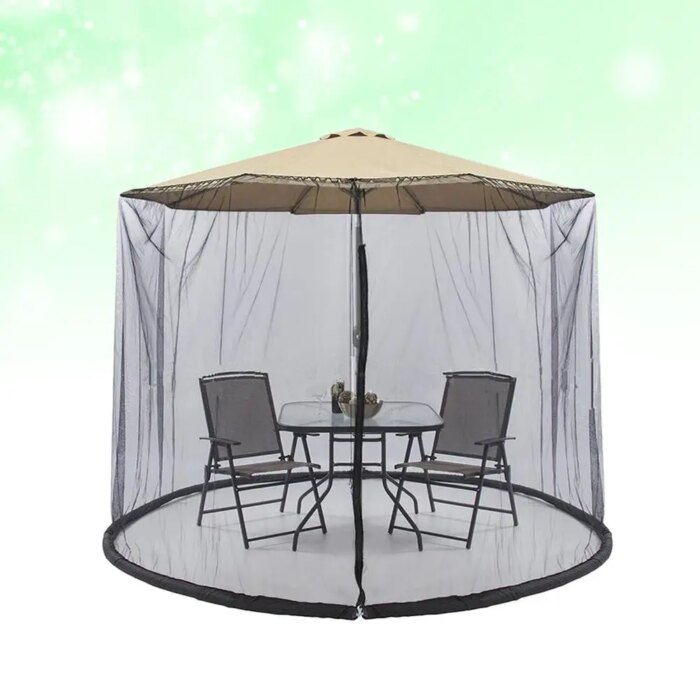 Patio umbrella with mosquito netting installed for an outdoor dinner party